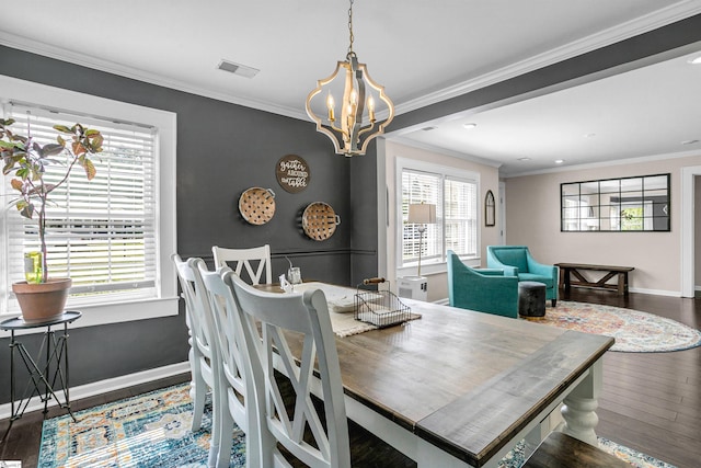 204 Thackston St, Fountain Inn, SC 29644 - dining area with wood finished floors, visible vents, baseboards, and an inviting chandelier