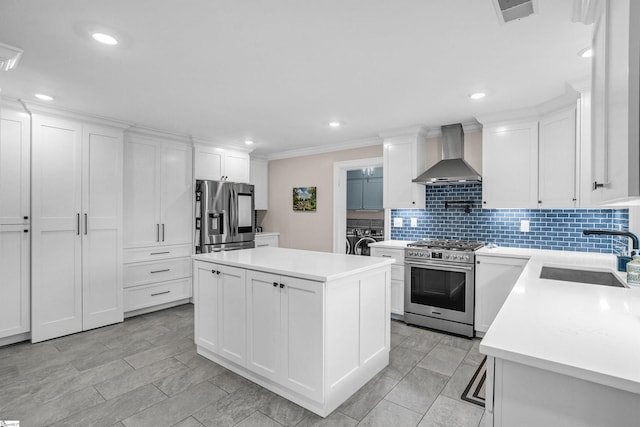 204 Thackston St, Fountain Inn, SC 29644 - kitchen with wall chimney range hood, a sink, backsplash, appliances with stainless steel finishes, and visible vents
