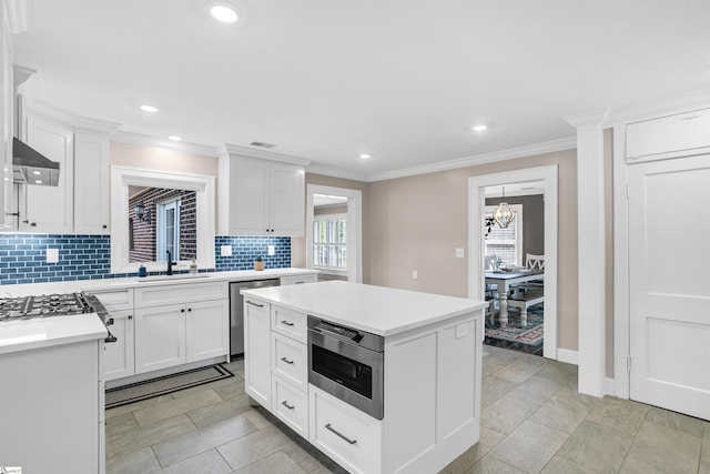 204 Thackston St, Fountain Inn, SC 29644 - kitchen with decorative backsplash, stainless steel dishwasher, light countertops, and a sink
