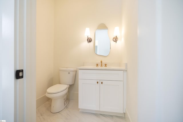 545 E Airport Rd, Greer, SC 29651 - half bath with baseboards, marble finish floor, vanity, and toilet