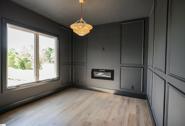 545 E Airport Rd, Greer, SC 29651 - empty room featuring light wood finished floors and a wealth of natural light