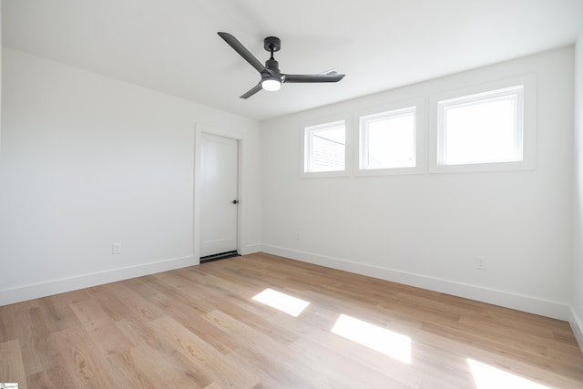 545 E Airport Rd, Greer, SC 29651 - spare room featuring light wood finished floors, baseboards, and ceiling fan