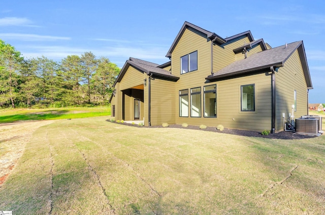 545 E Airport Rd, Greer, SC 29651 - rear view of property featuring central AC unit and a yard