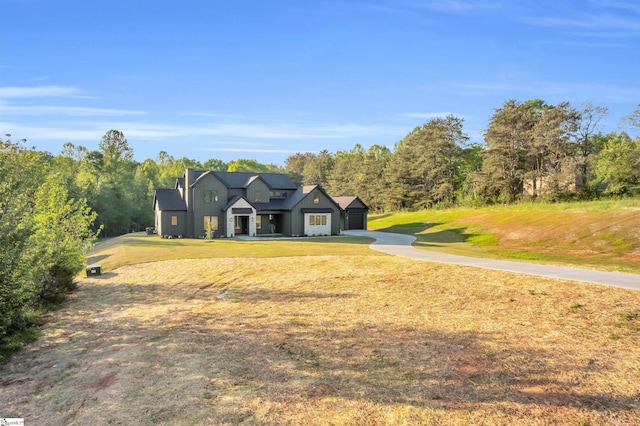545 E Airport Rd, Greer, SC 29651 - view of front of property featuring board and batten siding, driveway, and a front yard