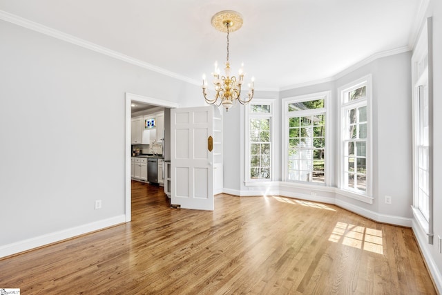 8 Atchison Way, Simpsonville, SC 29680 - unfurnished dining area with light wood-style floors, crown molding, baseboards, and an inviting chandelier