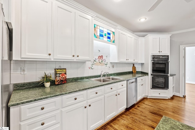 8 Atchison Way, Simpsonville, SC 29680 - kitchen with dobule oven black, stainless steel dishwasher, dark countertops, and a sink