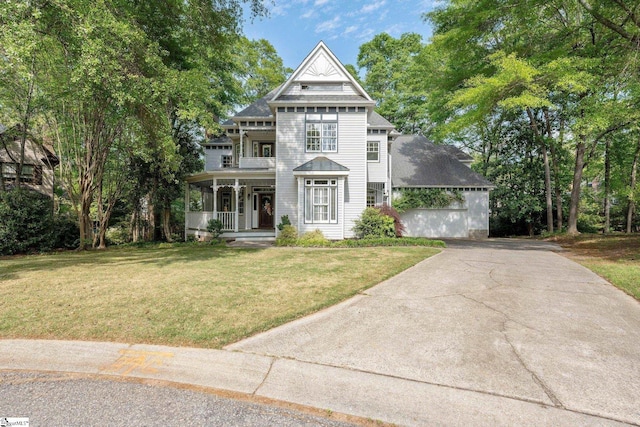 8 Atchison Way, Simpsonville, SC 29680 - victorian-style house with a porch, a front lawn, and concrete driveway