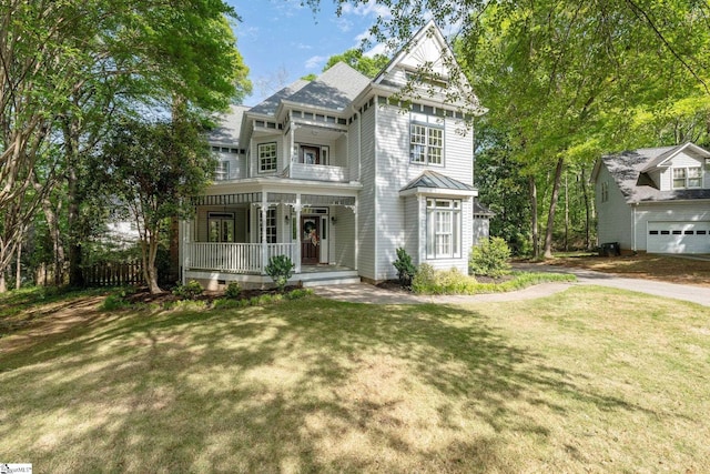 8 Atchison Way, Simpsonville, SC 29680 - victorian house featuring a front yard, a balcony, and covered porch