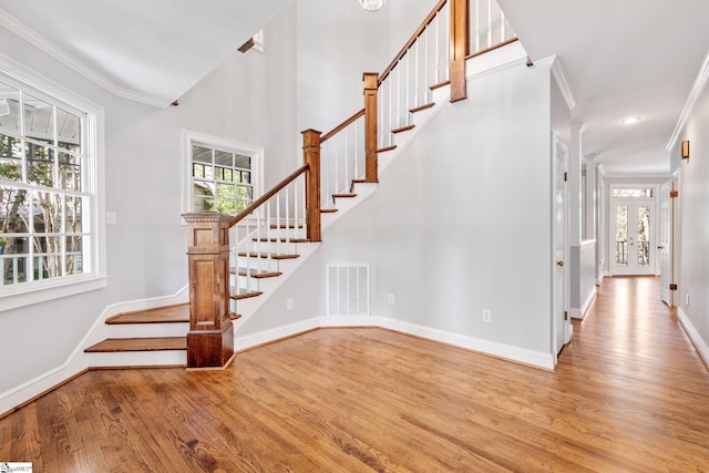8 Atchison Way, Simpsonville, SC 29680 - stairs featuring wood finished floors, visible vents, baseboards, and ornamental molding