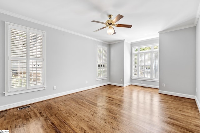 8 Atchison Way, Simpsonville, SC 29680 - spare room featuring a ceiling fan, crown molding, wood finished floors, and visible vents
