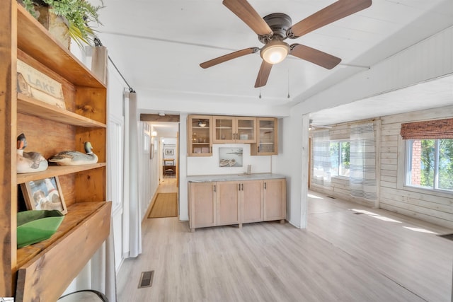1506 W Lakeshore Dr, Landrum, SC 29356 - kitchen featuring light countertops, visible vents, a ceiling fan, light wood-type flooring, and glass insert cabinets