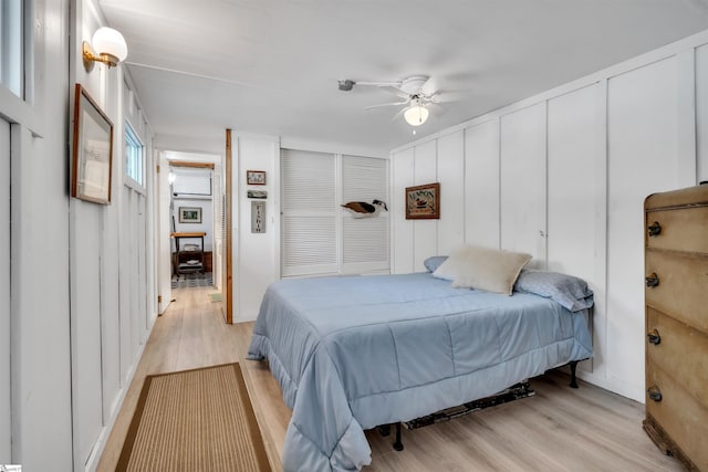 1506 W Lakeshore Dr, Landrum, SC 29356 - bedroom featuring a decorative wall, a ceiling fan, and light wood finished floors