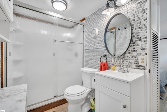 1506 W Lakeshore Dr, Landrum, SC 29356 - full bath with tile walls, vanity, toilet, and a stall shower