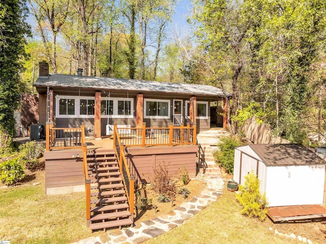 1506 W Lakeshore Dr, Landrum, SC 29356 - view of front of property with stairway, an outdoor structure, central AC, and a shed