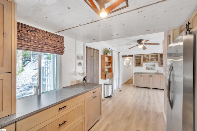 1506 W Lakeshore Dr, Landrum, SC 29356 - kitchen with light wood-type flooring, freestanding refrigerator, and light brown cabinetry
