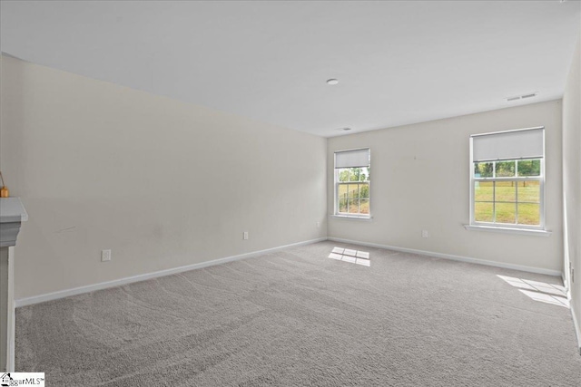 633 Morning Meadows Dr, Inman, SC 29349 - spare room featuring visible vents, baseboards, and carpet flooring