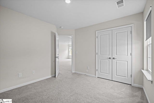633 Morning Meadows Dr, Inman, SC 29349 - unfurnished bedroom featuring baseboards, visible vents, carpet, and a closet