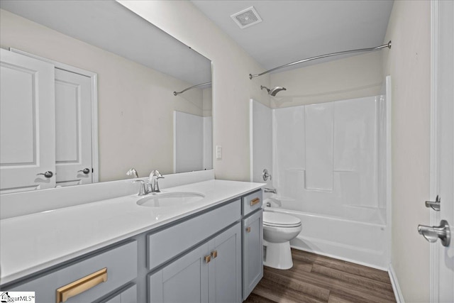 633 Morning Meadows Dr, Inman, SC 29349 - full bath with wood finished floors, visible vents, shower / bath combination, toilet, and vanity