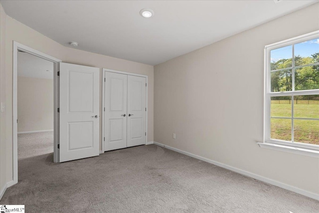 633 Morning Meadows Dr, Inman, SC 29349 - unfurnished bedroom featuring baseboards, carpet floors, and multiple windows