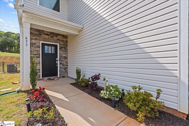 633 Morning Meadows Dr, Inman, SC 29349 - property entrance featuring stone siding, fence, and central air condition unit