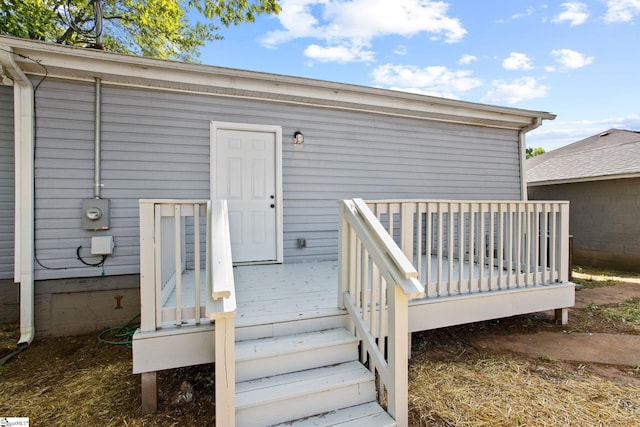 property entrance with a deck