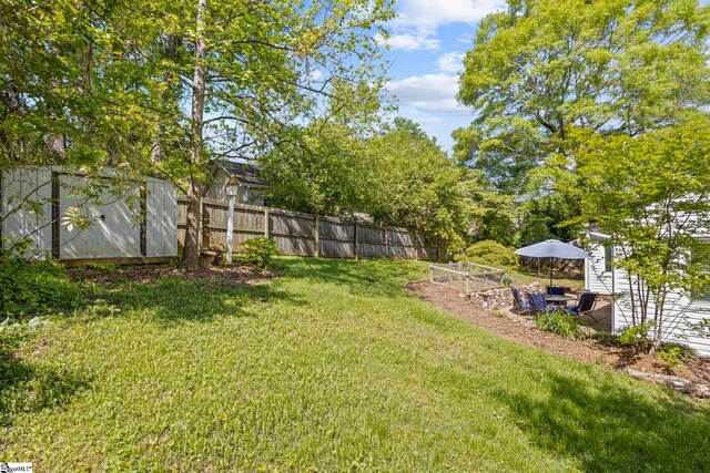210 Keith Dr, Greenville, SC 29607 - view of yard with fence, a storage unit, and an outbuilding