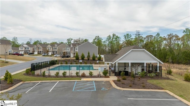 136 Light Spring Rd, Easley, SC 29642 - uncovered parking lot featuring fence, a residential view, and a community pool