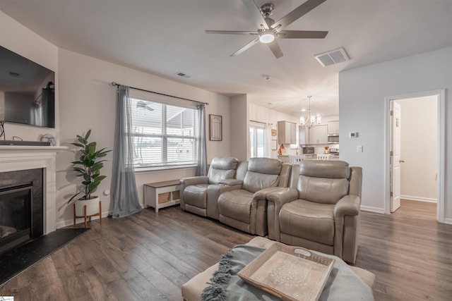 136 Light Spring Rd, Easley, SC 29642 - living area with visible vents, ceiling fan with notable chandelier, and dark wood-style flooring