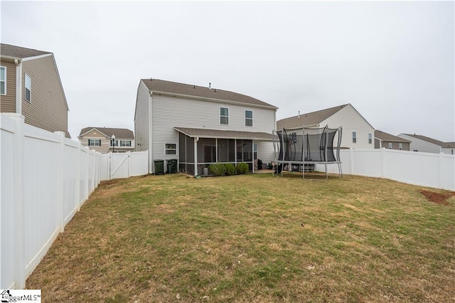 136 Light Spring Rd, Easley, SC 29642 - back of house featuring a sunroom, a yard, a fenced backyard, and a trampoline