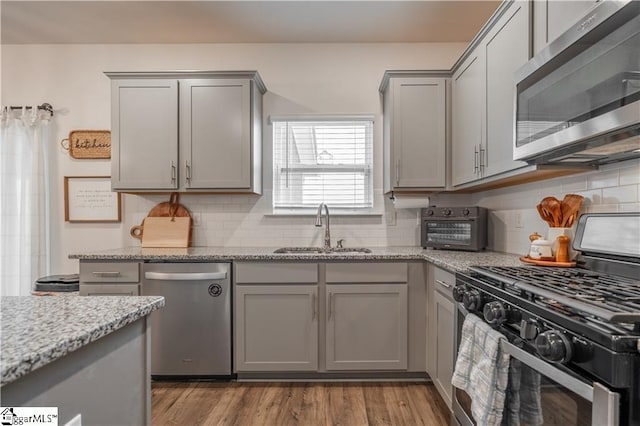 136 Light Spring Rd, Easley, SC 29642 - kitchen with a toaster, gray cabinetry, a sink, and stainless steel appliances