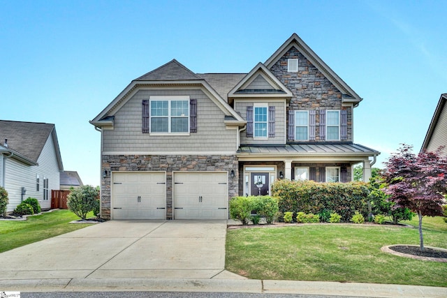 craftsman house featuring a front lawn, stone siding, and a garage