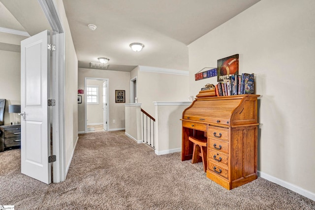 corridor with baseboards, carpet flooring, and an upstairs landing