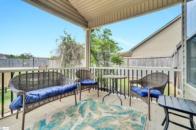 exterior space featuring outdoor lounge area and a fenced backyard