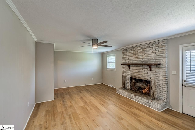 unfurnished living room featuring a textured ceiling, ceiling fan, and crown molding