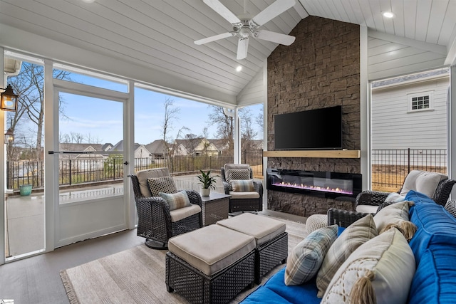 living room featuring plenty of natural light, wood finished floors, recessed lighting, and ceiling fan