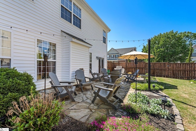 view of patio featuring fence