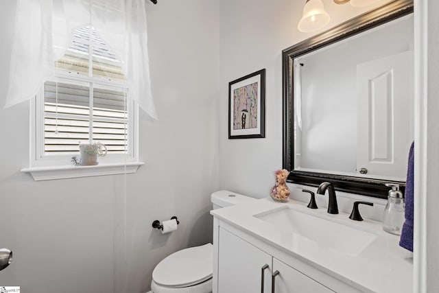 bathroom with vanity and toilet