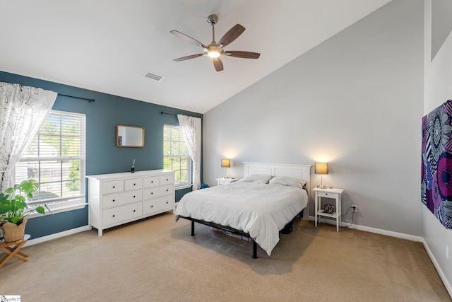 bedroom featuring high vaulted ceiling, baseboards, visible vents, and light colored carpet