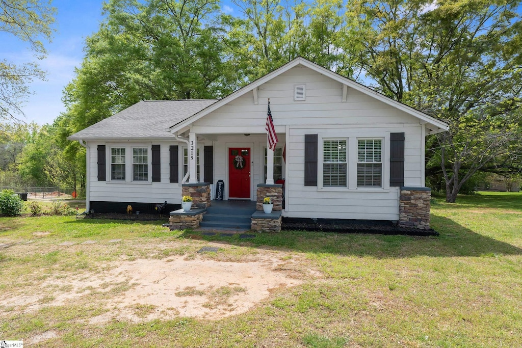 3215 Geer Hwy, Marietta, SC 29661 - view of front of property featuring a shingled roof and a front yard