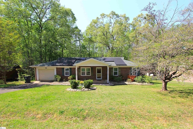 108 Dill Dr, Piedmont, SC 29673 - ranch-style home with a garage, brick siding, roof mounted solar panels, a front yard, and aphalt driveway