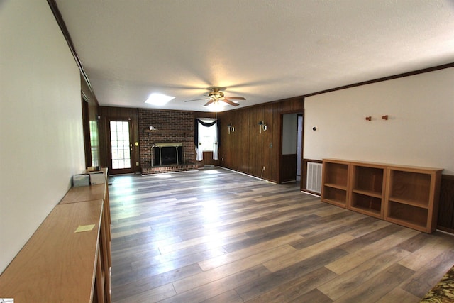 108 Dill Dr, Piedmont, SC 29673 - unfurnished living room featuring wood finished floors, visible vents, a fireplace, and ornamental molding