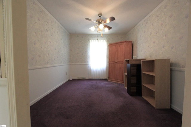 108 Dill Dr, Piedmont, SC 29673 - interior space featuring dark colored carpet, visible vents, wallpapered walls, ceiling fan, and crown molding