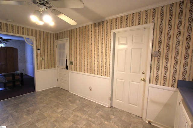 108 Dill Dr, Piedmont, SC 29673 - unfurnished room with wallpapered walls, a ceiling fan, stone finish flooring, crown molding, and wainscoting