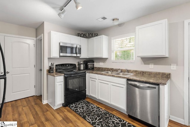 126 Rubin Ave, Anderson, SC 29624 - kitchen with dark countertops, a sink, stainless steel appliances, dark wood finished floors, and visible vents
