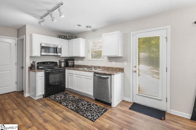 126 Rubin Ave, Anderson, SC 29624 - kitchen featuring stainless steel appliances, dark wood-style floors, a sink, and white cabinetry