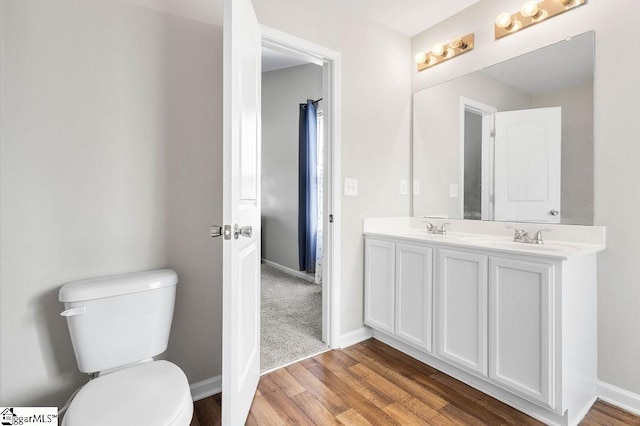 126 Rubin Ave, Anderson, SC 29624 - bathroom with toilet, wood finished floors, double vanity, and a sink