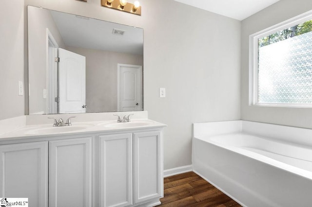 126 Rubin Ave, Anderson, SC 29624 - bathroom with double vanity, wood finished floors, visible vents, and a sink