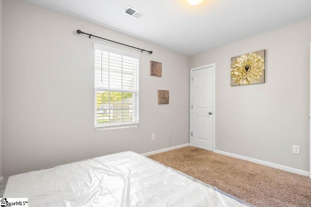 126 Rubin Ave, Anderson, SC 29624 - unfurnished bedroom with baseboards, carpet flooring, and visible vents