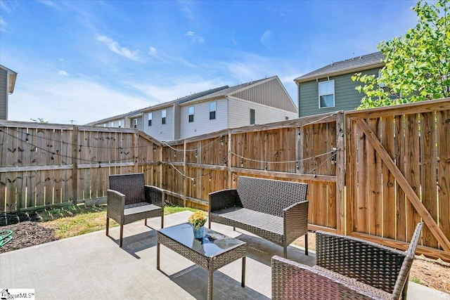 view of patio / terrace with a fenced backyard and an outdoor living space