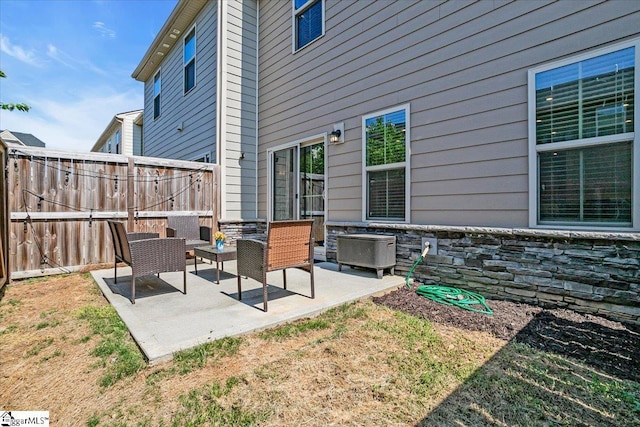 view of patio featuring fence